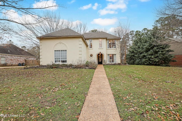 view of front of home with a front lawn