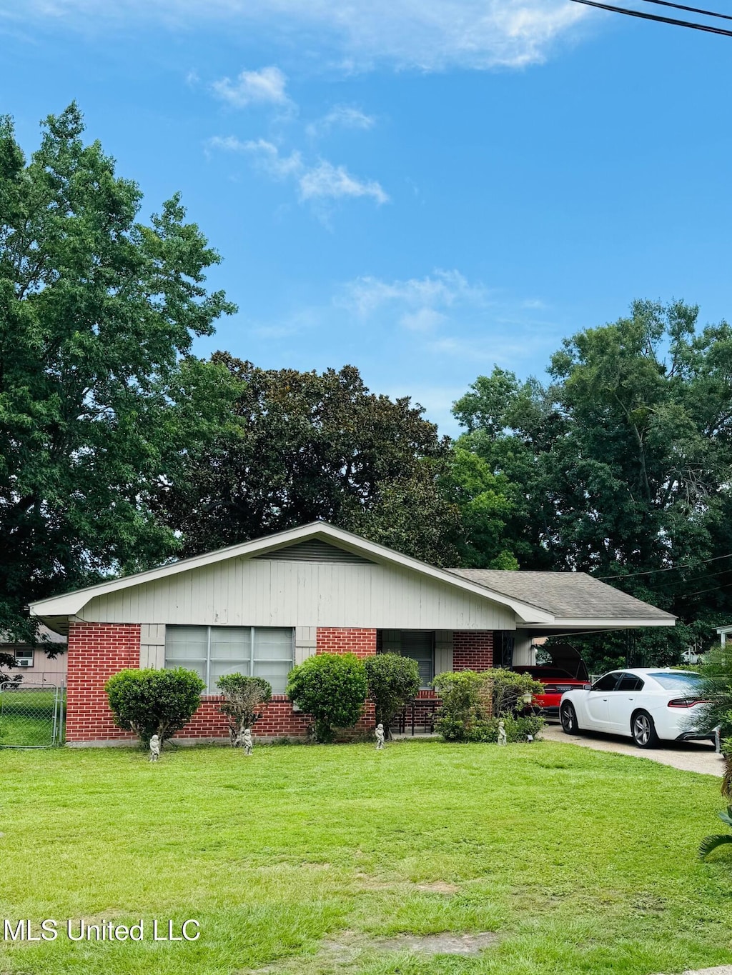 360 Spratley Ave, Biloxi, MS 39531 - ranch-style house with a carport and brick siding