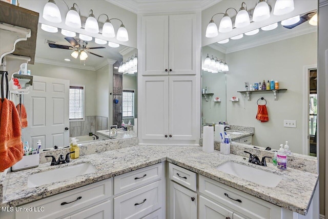 full bathroom featuring crown molding, double vanity, ceiling fan, and a sink