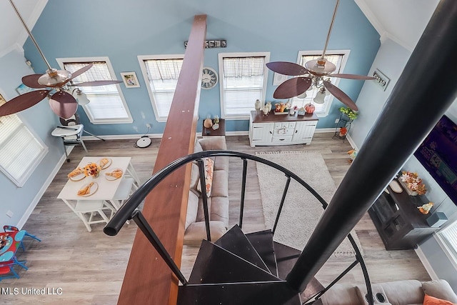 11162 New York St, Bay Saint Louis, MS 39520 - stairs with ceiling fan, wood finished floors, baseboards, crown molding, and lofted ceiling