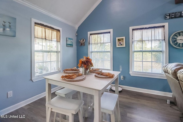 11162 New York St, Bay Saint Louis, MS 39520 - dining room featuring ornamental molding, lofted ceiling, healthy amount of natural light, dark wood-style flooring, and baseboards