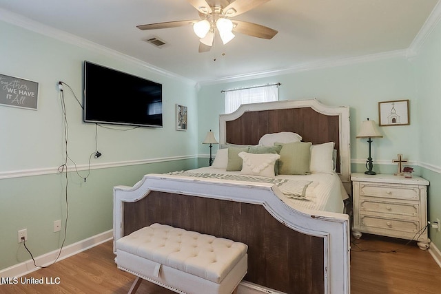 11162 New York St, Bay Saint Louis, MS 39520 - bedroom with crown molding, wood finished floors, ceiling fan, and baseboards