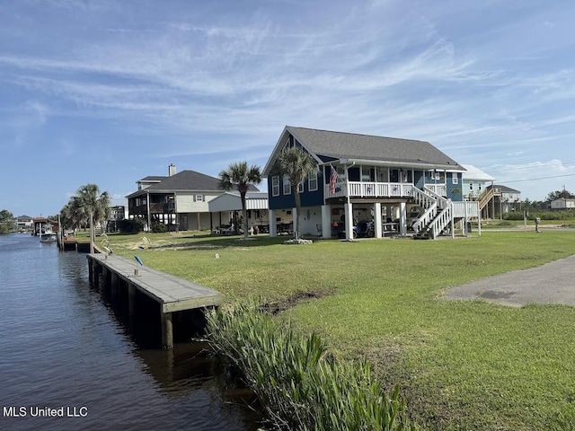 11162 New York St, Bay Saint Louis, MS 39520 - dock featuring stairway, a yard, and a deck with water view
