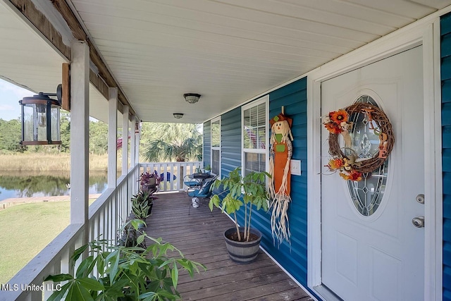 11162 New York St, Bay Saint Louis, MS 39520 - wooden porch featuring a water view