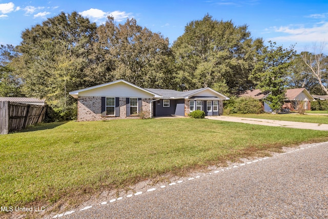 ranch-style home with a front yard