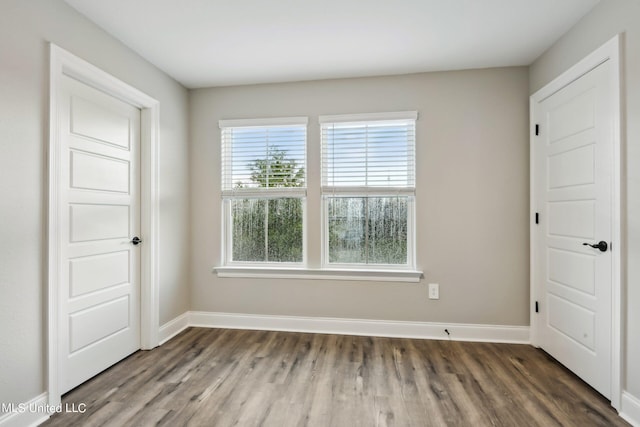 unfurnished bedroom featuring dark hardwood / wood-style floors