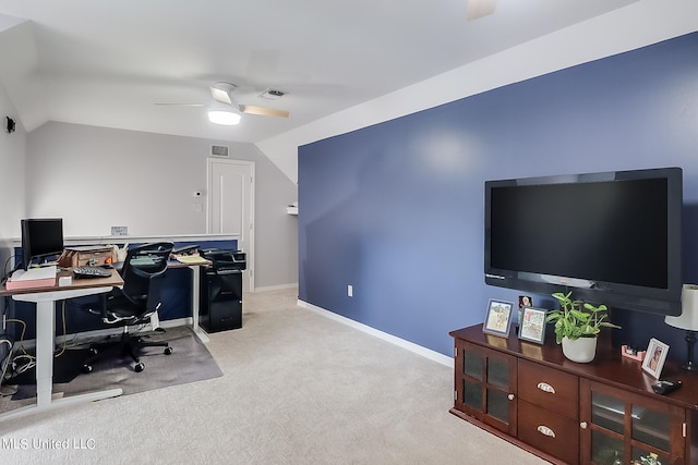 office space with light colored carpet, ceiling fan, and vaulted ceiling