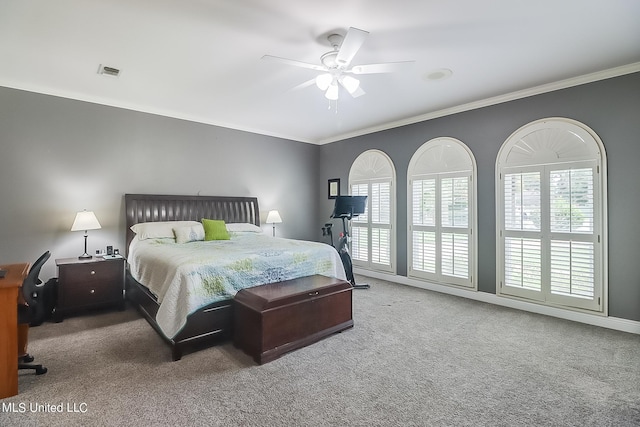 bedroom with carpet floors, ornamental molding, and ceiling fan