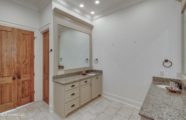 bathroom with vanity, crown molding, and tile patterned floors