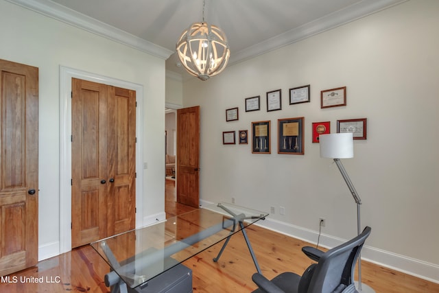 workout area featuring ornamental molding, a chandelier, and wood-type flooring