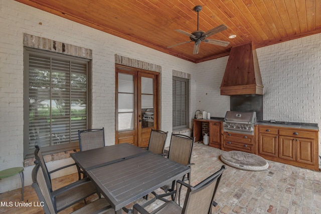 view of patio featuring area for grilling, ceiling fan, french doors, and a grill