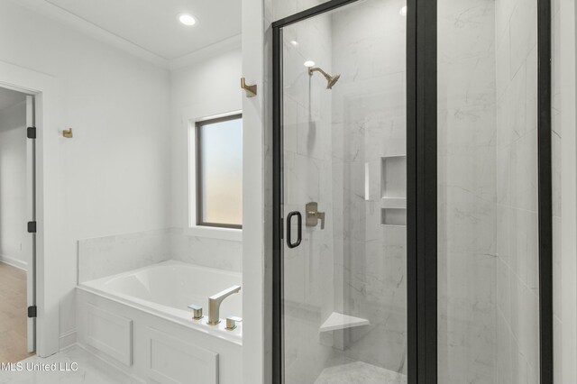 bathroom with separate shower and tub