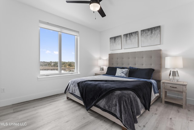 bedroom featuring ceiling fan and light hardwood / wood-style floors