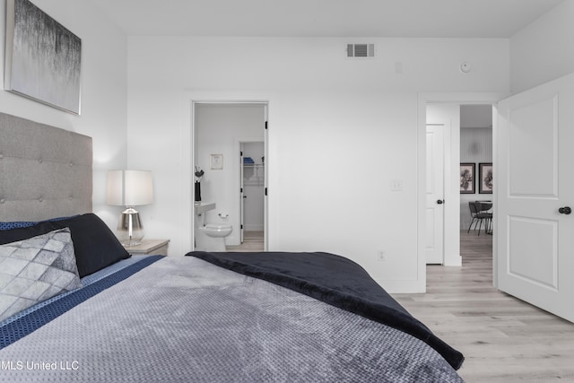 bedroom featuring light wood-type flooring