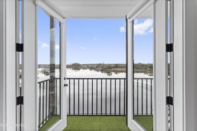 unfurnished sunroom with a water view and plenty of natural light