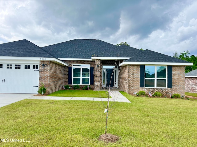 view of front facade with a garage and a front yard