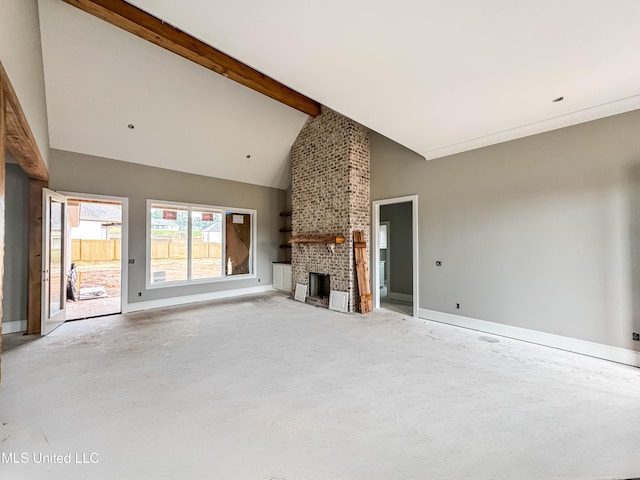 501 Harper Cv, Flowood, MS 39232 - unfurnished living room with a fireplace, beam ceiling, baseboards, high vaulted ceiling, and concrete flooring