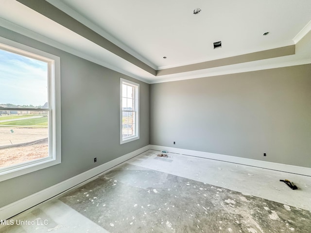 501 Harper Cv, Flowood, MS 39232 - spare room featuring a tray ceiling, baseboards, and ornamental molding