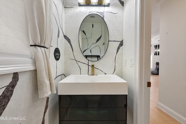 bathroom with hardwood / wood-style floors and vanity