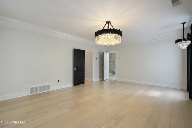 unfurnished room with crown molding, a chandelier, and light hardwood / wood-style flooring