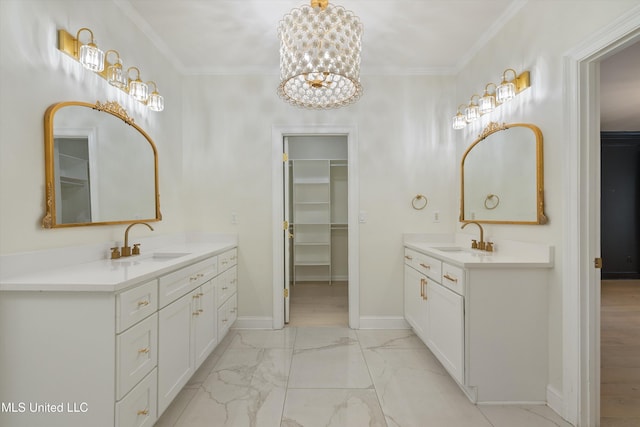 bathroom featuring vanity, a notable chandelier, and ornamental molding