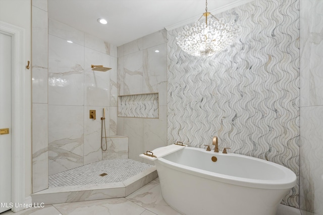 bathroom featuring separate shower and tub, a notable chandelier, and tile walls