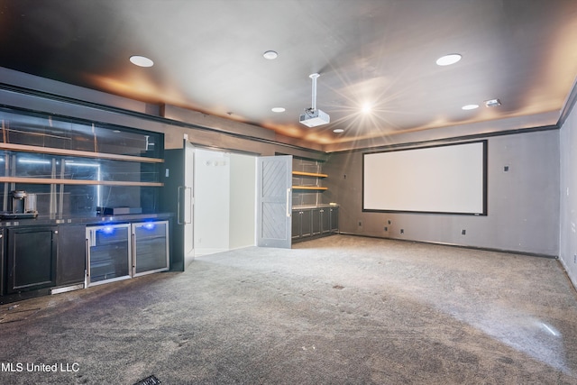 carpeted home theater featuring wine cooler