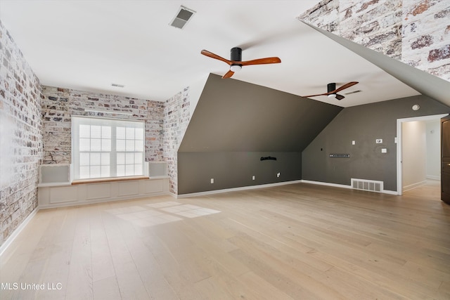 bonus room featuring ceiling fan, light hardwood / wood-style flooring, and lofted ceiling