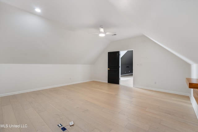 additional living space featuring ceiling fan, light hardwood / wood-style floors, and lofted ceiling