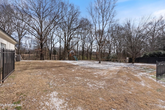 view of yard with a playground and central air condition unit