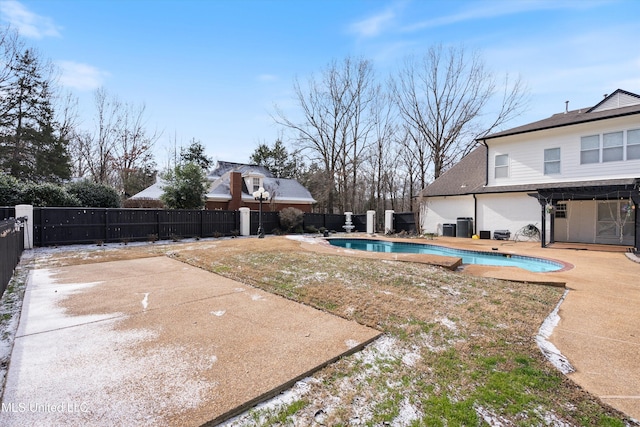 view of yard with a fenced in pool and a patio