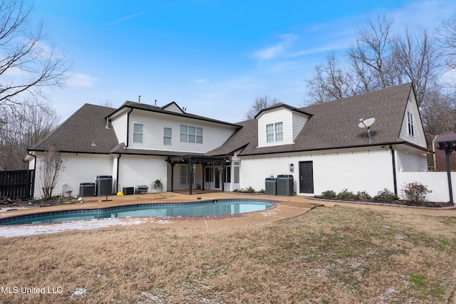 back of house with central AC, a patio, and a pergola