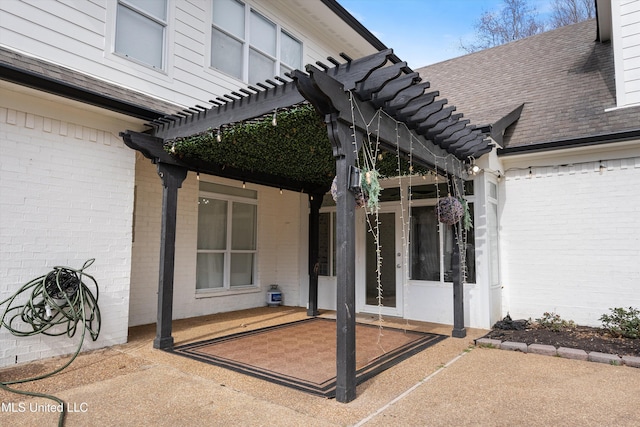 property entrance with a patio and a pergola