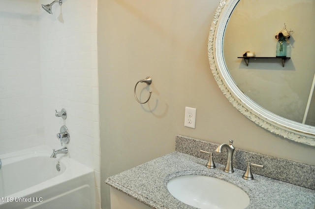 bathroom with vanity and tiled shower / bath combo