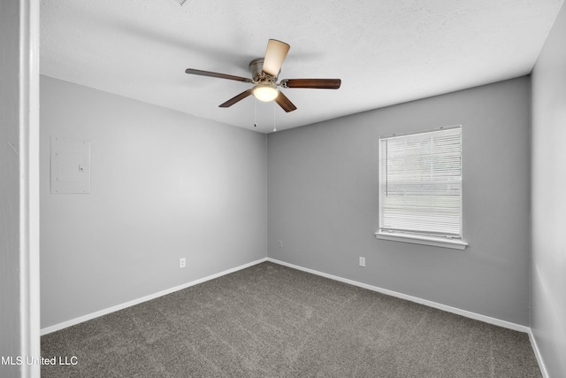 empty room featuring a textured ceiling, ceiling fan, baseboards, and carpet floors