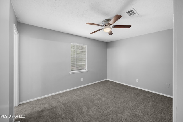 spare room featuring ceiling fan, a textured ceiling, visible vents, carpet floors, and baseboards