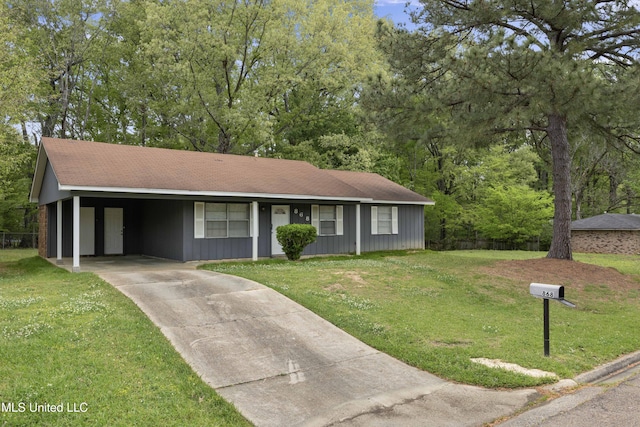 ranch-style house with an attached carport, a front yard, and concrete driveway
