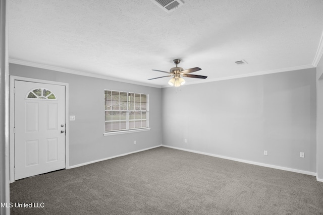 carpeted entryway featuring ornamental molding, visible vents, ceiling fan, and plenty of natural light