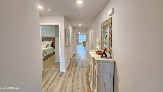 hall with light wood-type flooring