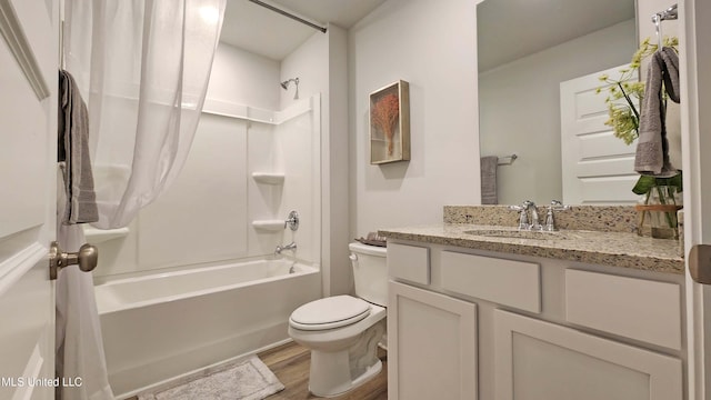 full bathroom with shower / tub combination, vanity, toilet, and wood-type flooring