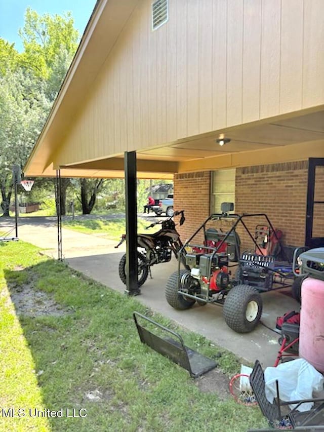 surrounding community with a yard, a patio, and a carport