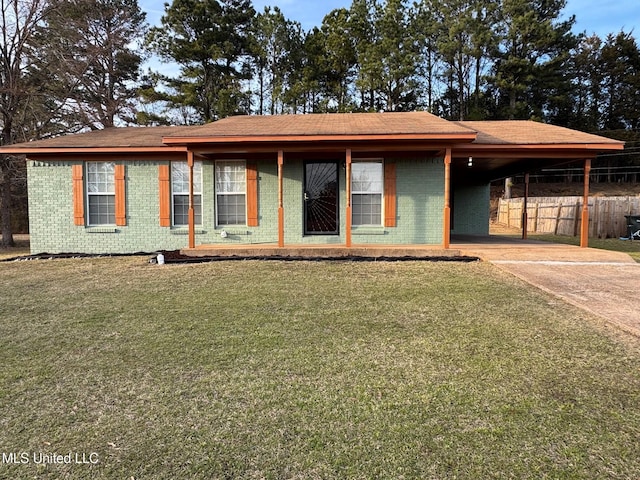 ranch-style home featuring an attached carport, brick siding, concrete driveway, and a front lawn