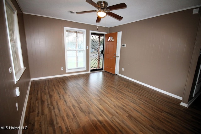 entrance foyer with ceiling fan, baseboards, crown molding, and dark wood-type flooring