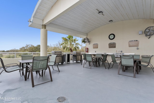 2060 Beach Blvd Unit 102, Biloxi, MS 39531 - view of patio / terrace with an outdoor kitchen and outdoor dining area