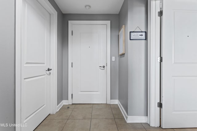 2060 Beach Blvd Unit 102, Biloxi, MS 39531 - hall with baseboards and light tile patterned flooring