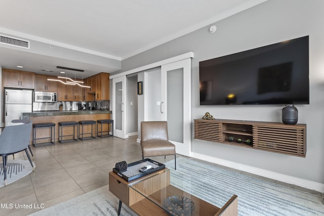 2060 Beach Blvd Unit 102, Biloxi, MS 39531 - living room featuring light tile patterned flooring and baseboards