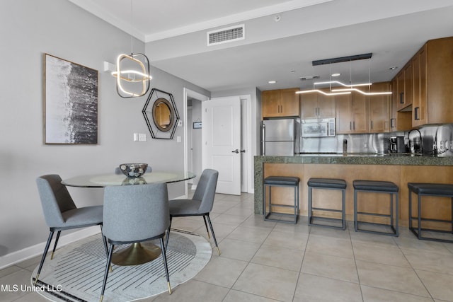 2060 Beach Blvd Unit 102, Biloxi, MS 39531 - dining room featuring light tile patterned flooring and baseboards