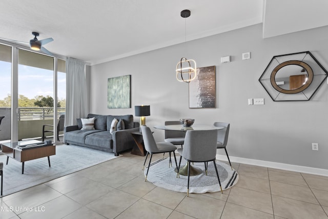 2060 Beach Blvd Unit 102, Biloxi, MS 39531 - dining room featuring light tile patterned floors, a ceiling fan, and expansive windows