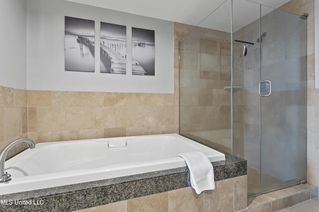 2060 Beach Blvd Unit 102, Biloxi, MS 39531 - full bath with a shower stall and a bath