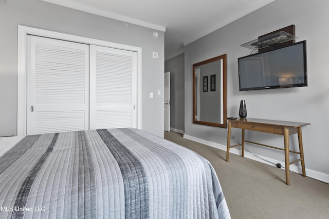 2060 Beach Blvd Unit 102, Biloxi, MS 39531 - bedroom with carpet flooring, a closet, and crown molding